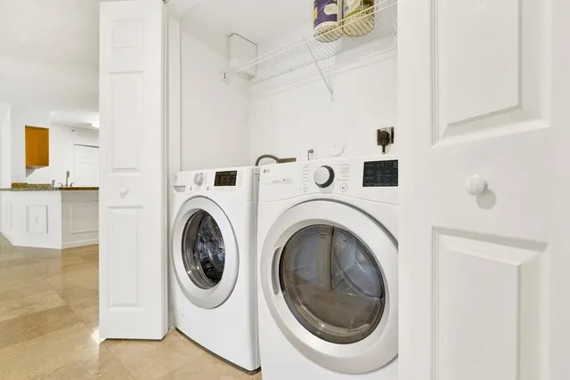 a utility room with dryer and washer