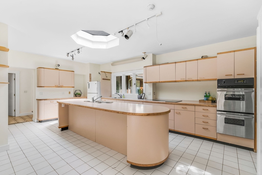 66 Taylor Road Stow, MA 01775 - Photo 11 of 42 a kitchen with cabinets a sink and appliances