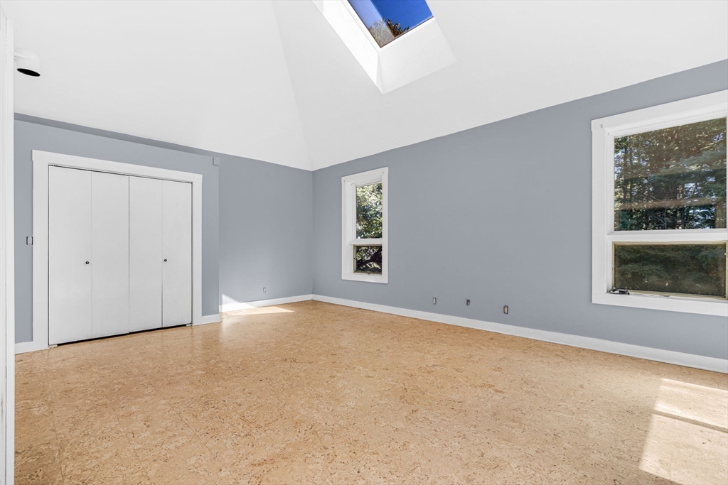 66 Taylor Road Stow, MA 01775 - Photo 17 of 42 a view of an empty room with a window