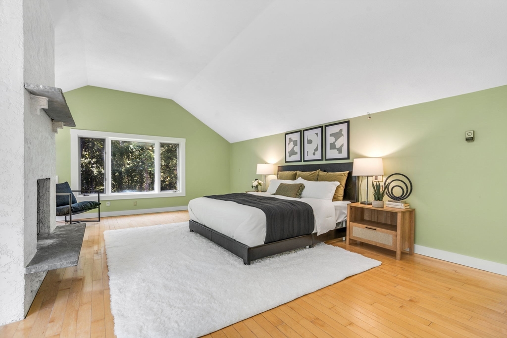 66 Taylor Road Stow, MA 01775 - Photo 26 of 42 a spacious bedroom with a bed and window