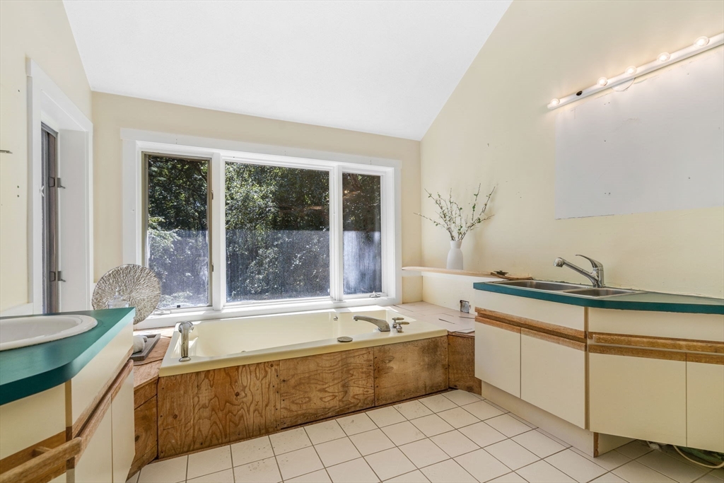 66 Taylor Road Stow, MA 01775 - Photo 27 of 42 a spacious bathroom with a tub and sink
