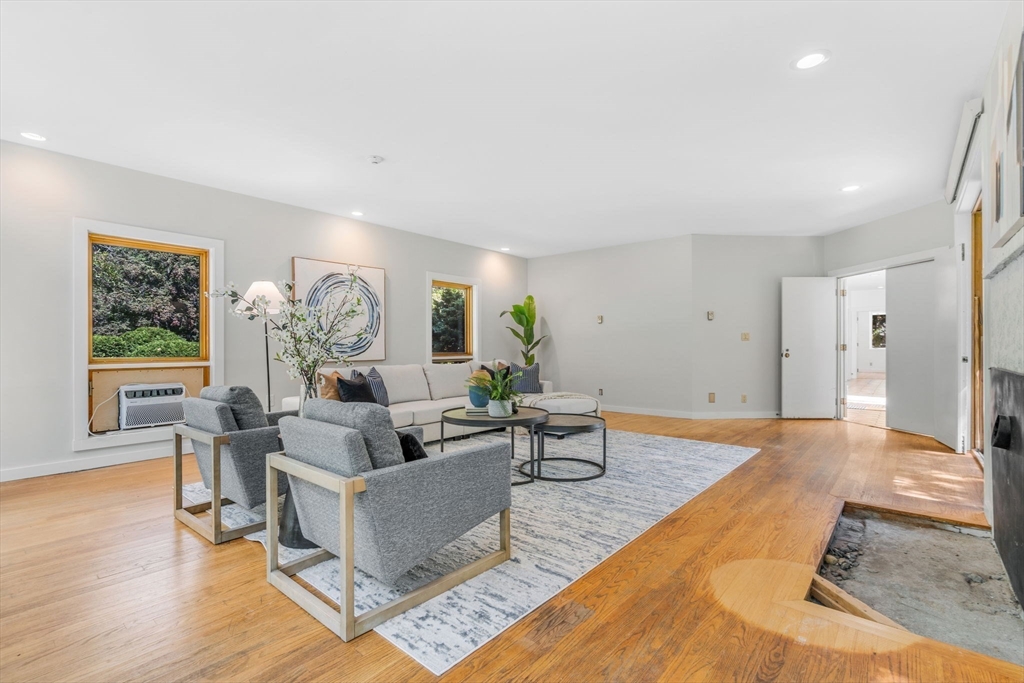 66 Taylor Road Stow, MA 01775 - Photo 9 of 42 a living room with furniture and a large window