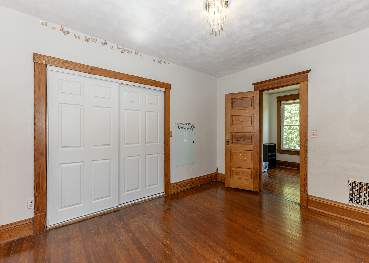 112 South State Street Atkinson, IL 61235 - Photo 21 of 24 an empty room with wooden floor and closet