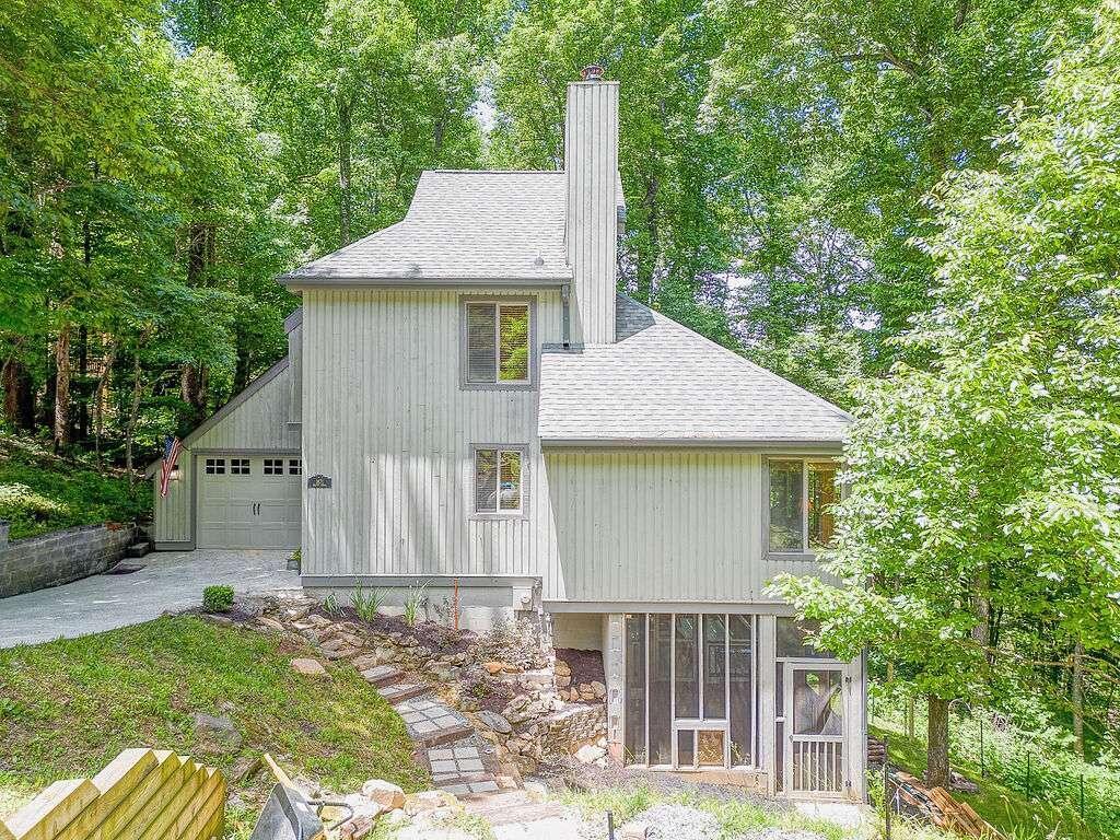 1871 Walnut Ridge Ellijay, GA 30536 - Photo 1 of 1 a front view of a house with garden