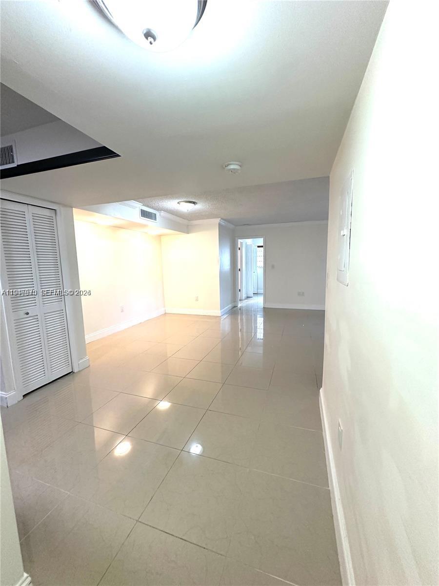 919 Northeast 199th Street, Unit 104 Miami, FL 33179 - Photo 14 of 19 a view of empty room