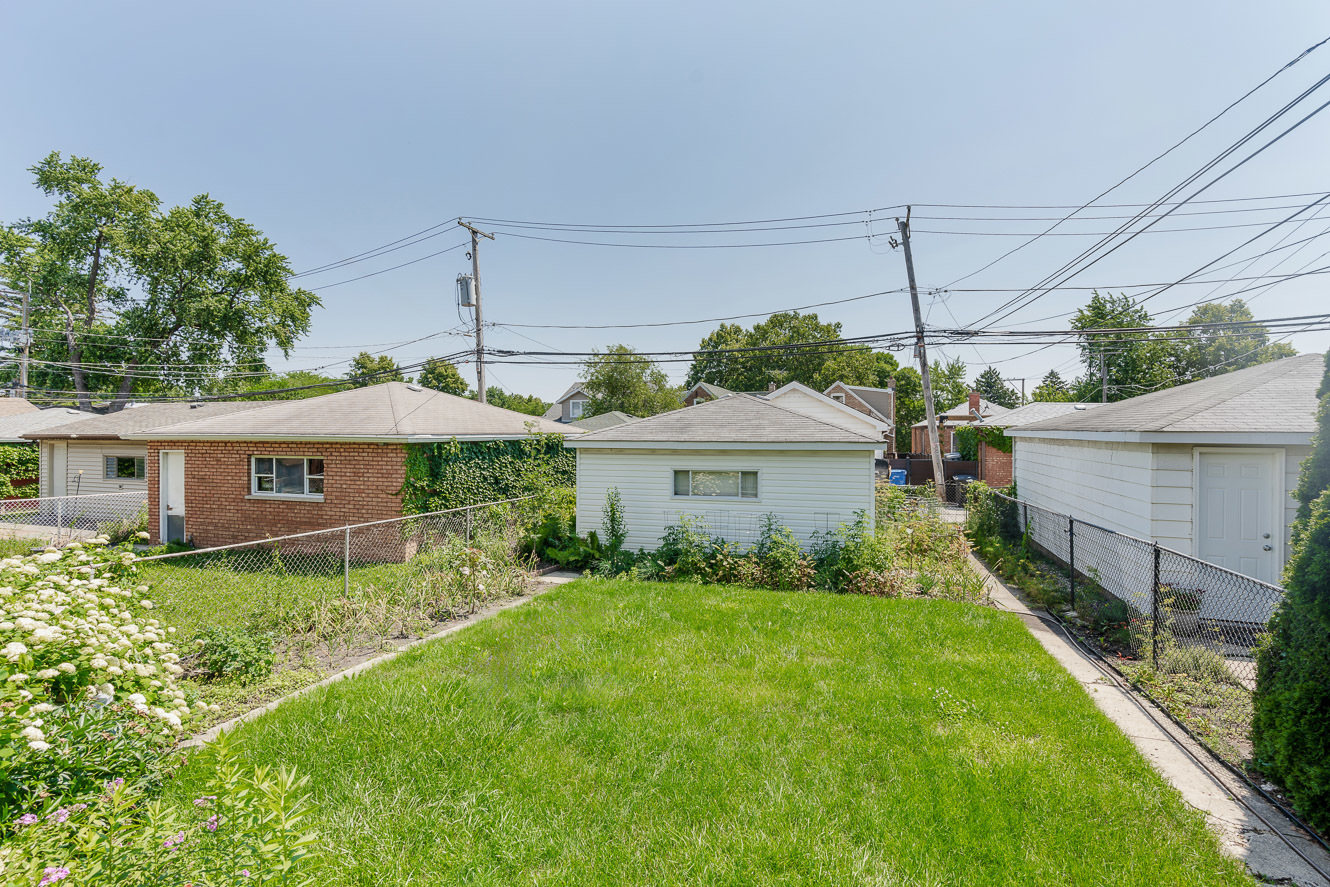 5219 North Rutherford Avenue, Unit 2 Chicago, IL 60656 - Photo 10 of 10 a front view of house with yard and green space