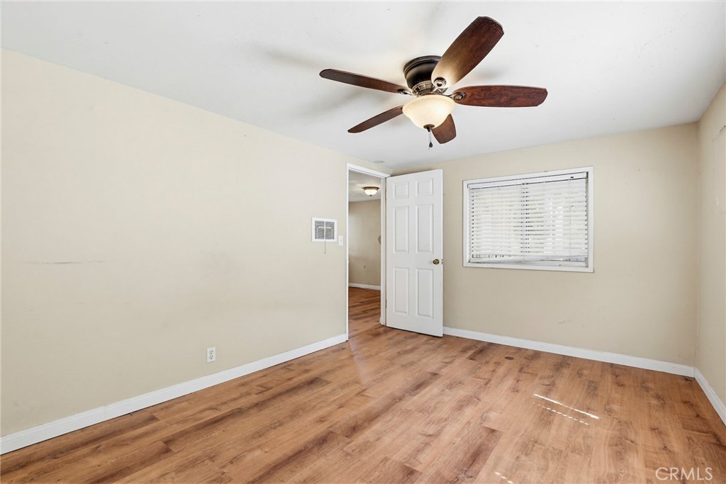 7264 Hillrose Street Tujunga, CA 91042 - Photo 15 of 27 a view of an empty room with wooden floor