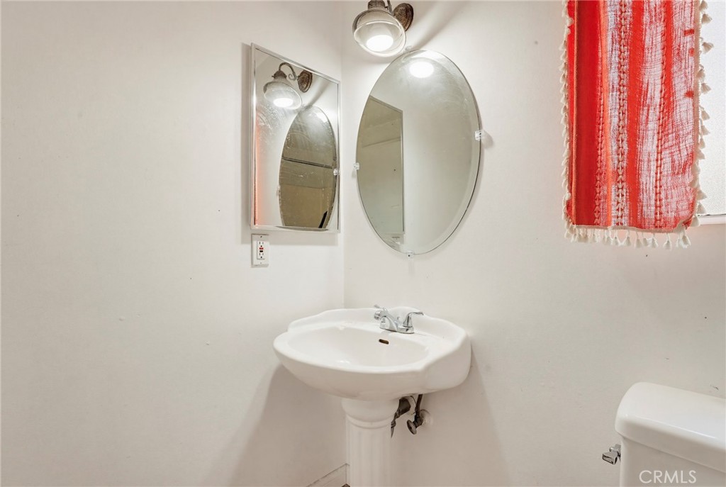 7264 Hillrose Street Tujunga, CA 91042 - Photo 16 of 27 a bathroom with a sink and a mirror