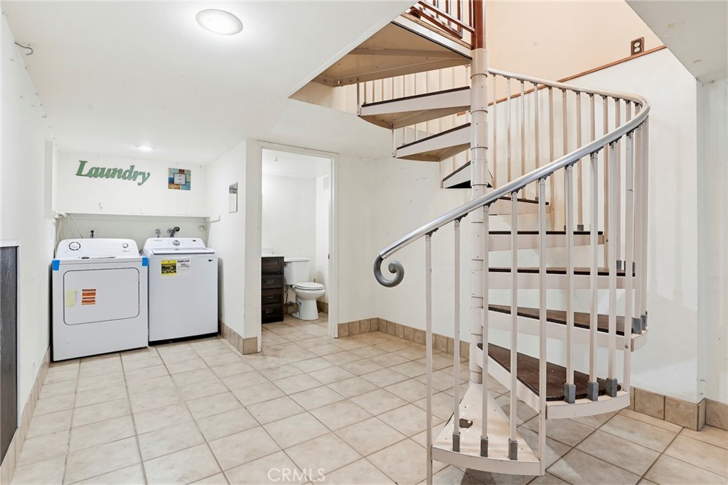 7264 Hillrose Street Tujunga, CA 91042 - Photo 19 of 27 a utility room with multiple dryer and washer