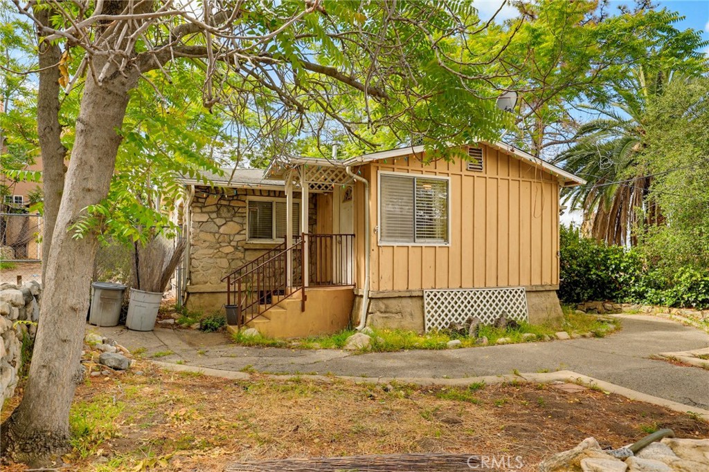 7264 Hillrose Street Tujunga, CA 91042 - Photo 2 of 27 a front view of a house with a yard