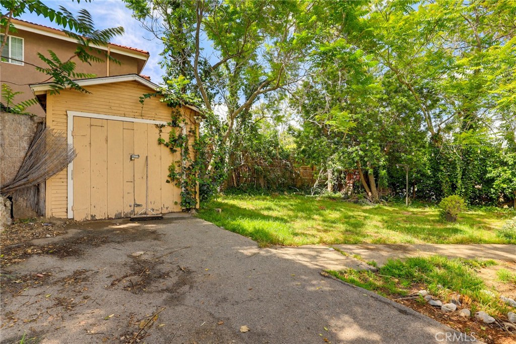 7264 Hillrose Street Tujunga, CA 91042 - Photo 25 of 27 a view of a house with a yard