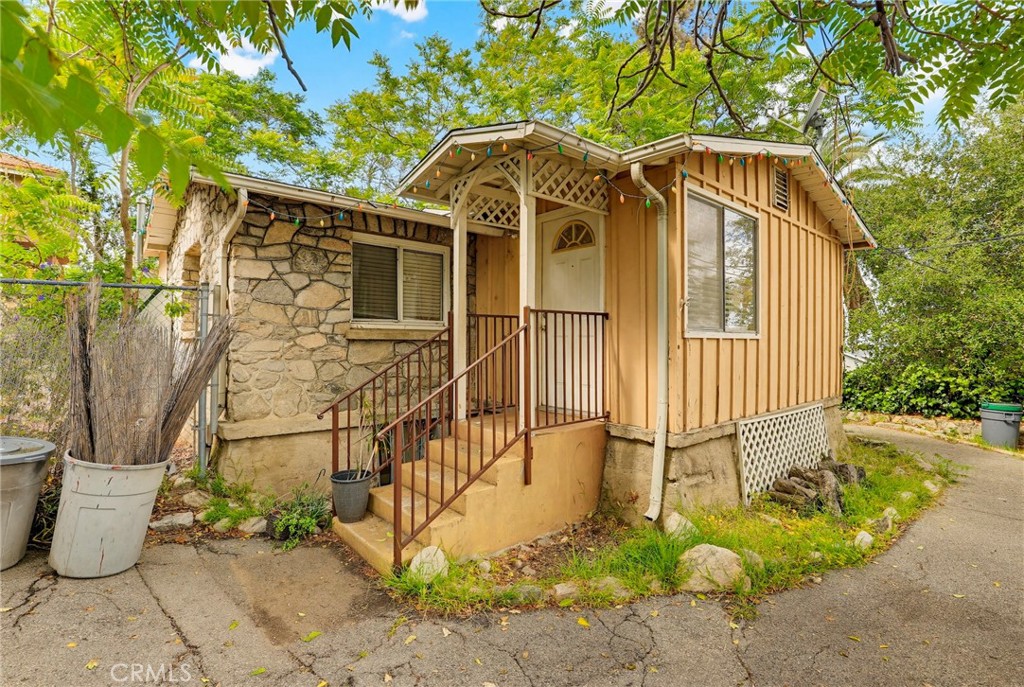 7264 Hillrose Street Tujunga, CA 91042 - Photo 3 of 27 a front view of a house with a yard