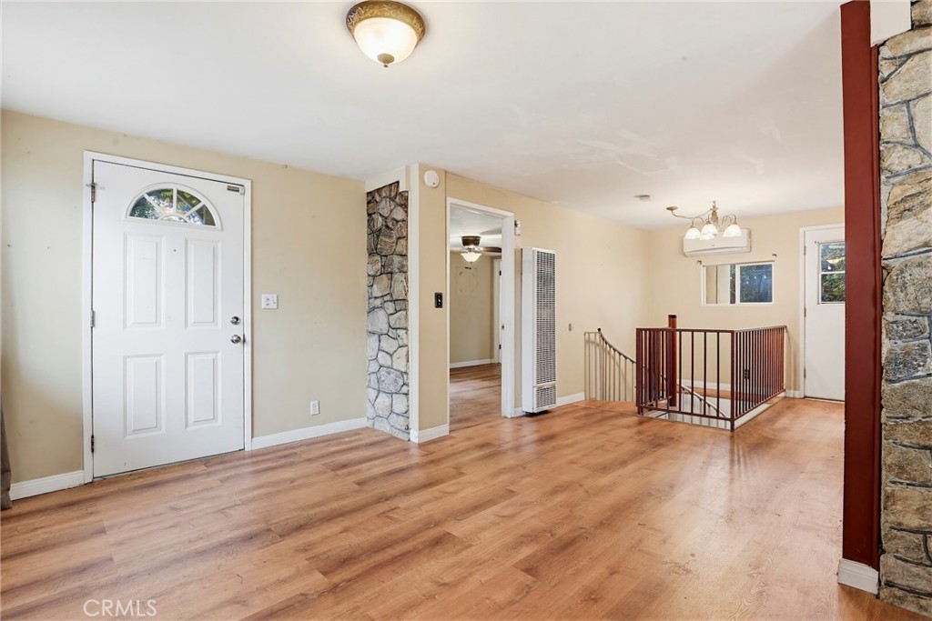 7264 Hillrose Street Tujunga, CA 91042 - Photo 6 of 27 an empty room with wooden floor and windows