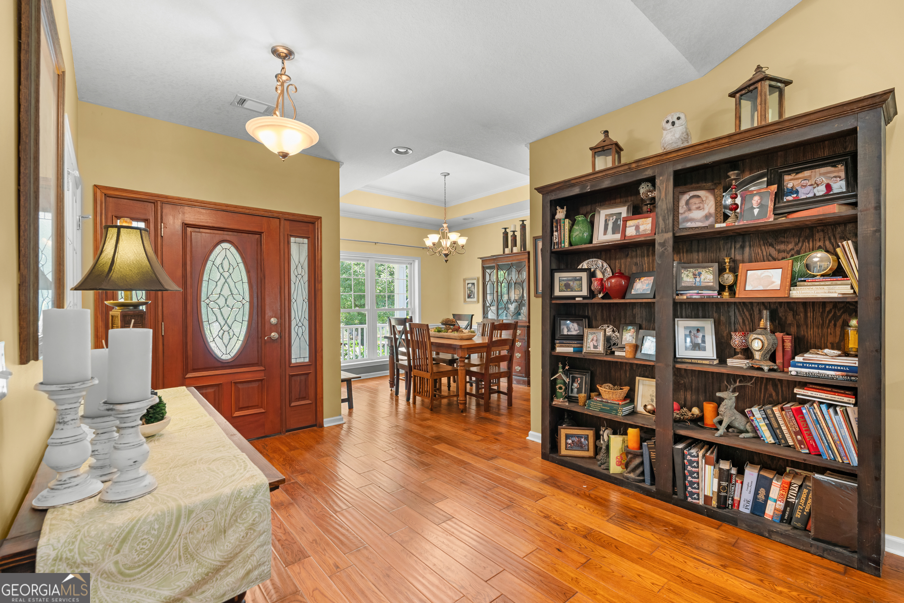 480 Best Bridge Road Sylvania, GA 30467 - Photo 20 of 57 a living room with lots of furniture a rug and a book shelf