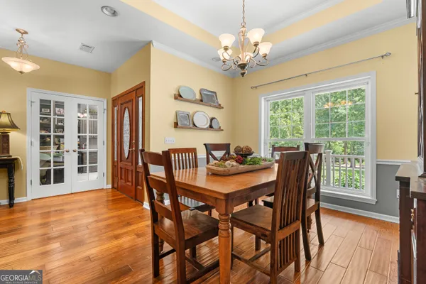 a bedroom with a bed and a flat screen television