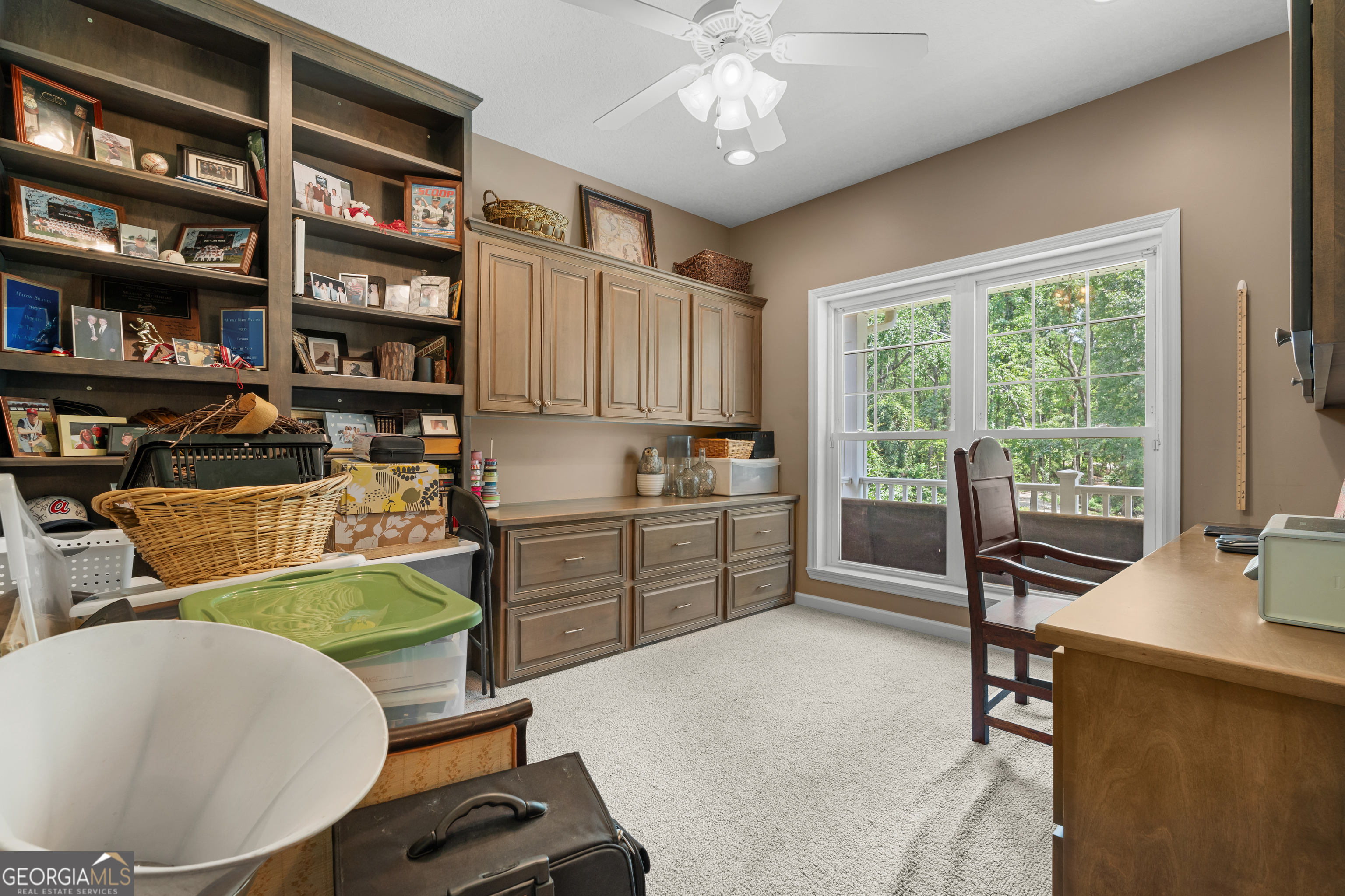 480 Best Bridge Road Sylvania, GA 30467 - Photo 23 of 57 a living room with furniture a bookshelf and a window