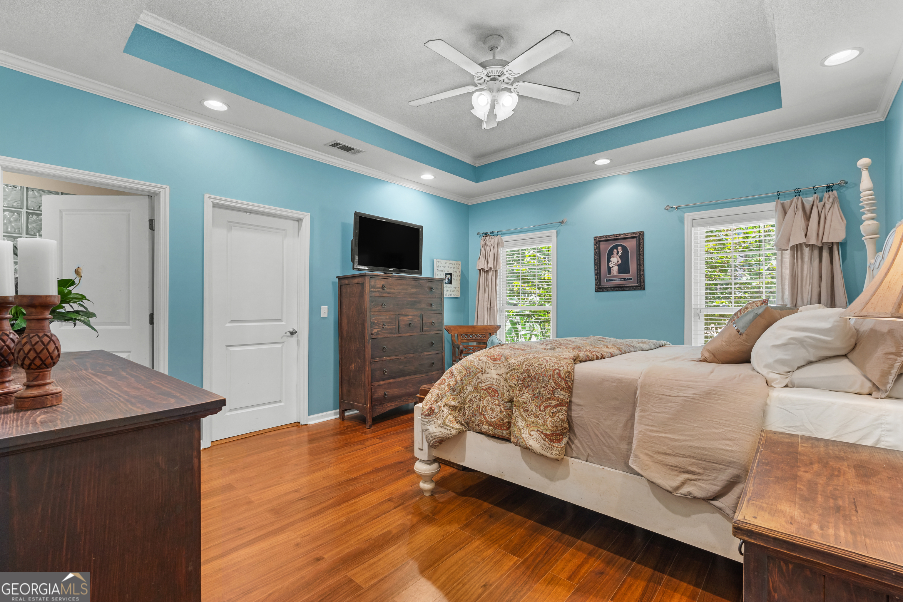 480 Best Bridge Road Sylvania, GA 30467 - Photo 24 of 57 a bedroom with a bed and a flat screen television