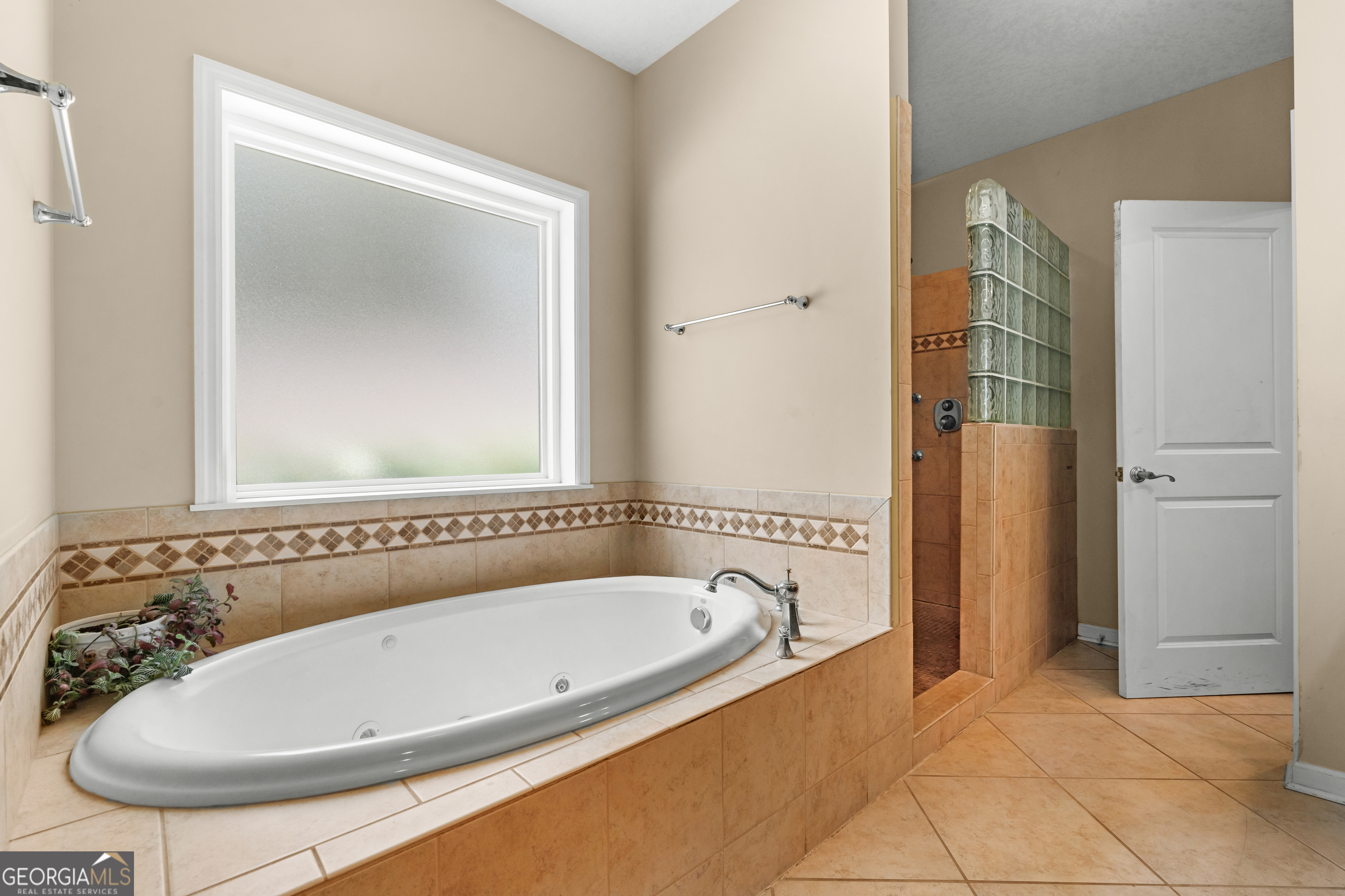 480 Best Bridge Road Sylvania, GA 30467 - Photo 27 of 57 a bathroom with a tub and a shower