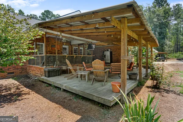 a view of a patio with wooden floor