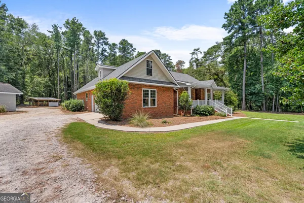 a view of a house with entryway and stairs