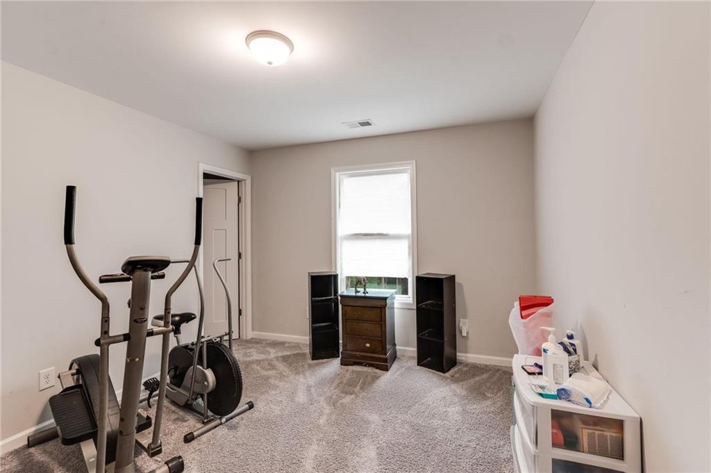 227 Waters Edge Parkway Temple, GA 30179 - Photo 14 of 26 a view of a room with gym equipment