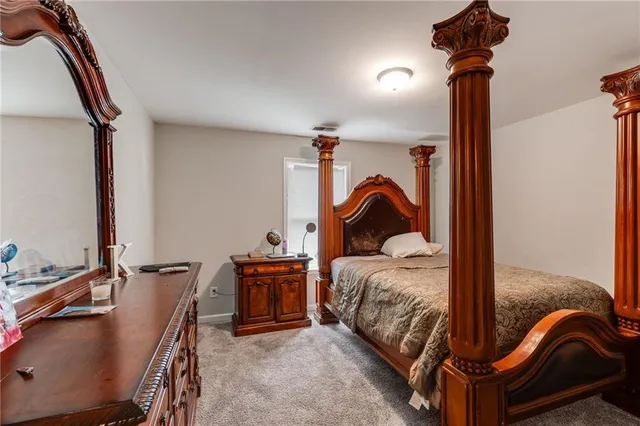 a bedroom with a bed and a gym equipment