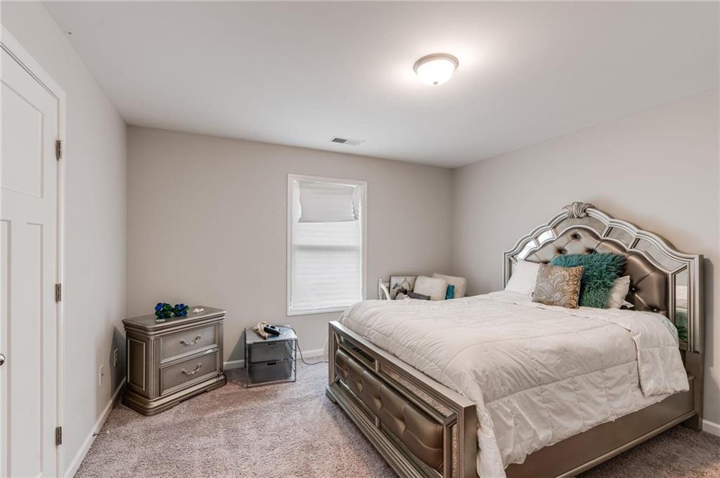 227 Waters Edge Parkway Temple, GA 30179 - Photo 16 of 26 a bedroom with a bed and a view of bedroom