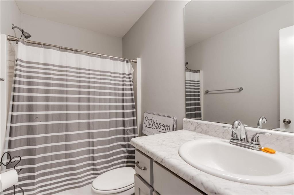 227 Waters Edge Parkway Temple, GA 30179 - Photo 17 of 26 a bathroom with a sink toilet and shower