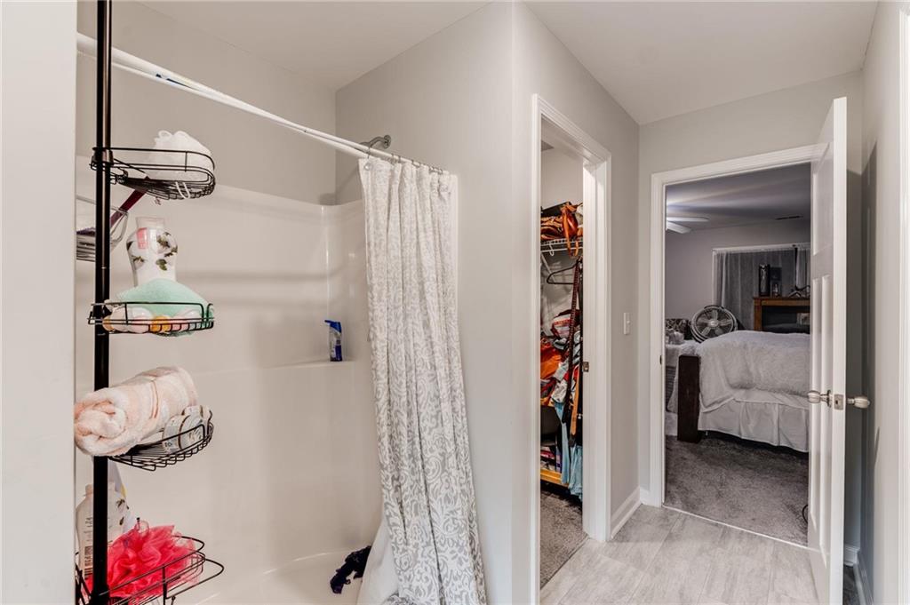 227 Waters Edge Parkway Temple, GA 30179 - Photo 21 of 26 a view of walk in closet with clothes and shoes