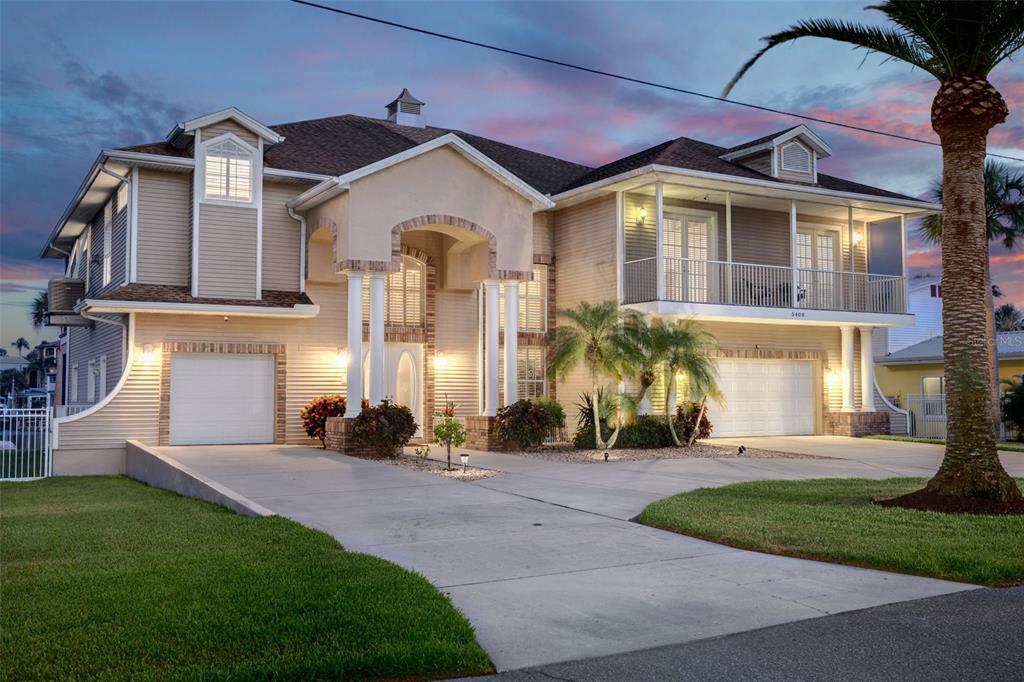 5400 Bellview Avenue New Port Richey, FL 34652 - Photo 1 of 1 a front view of a house with a yard