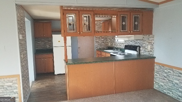 2331 Kesler Road Carnesville, GA 30521 - Photo 30 of 50 a kitchen with stainless steel appliances granite countertop a refrigerator and a stove