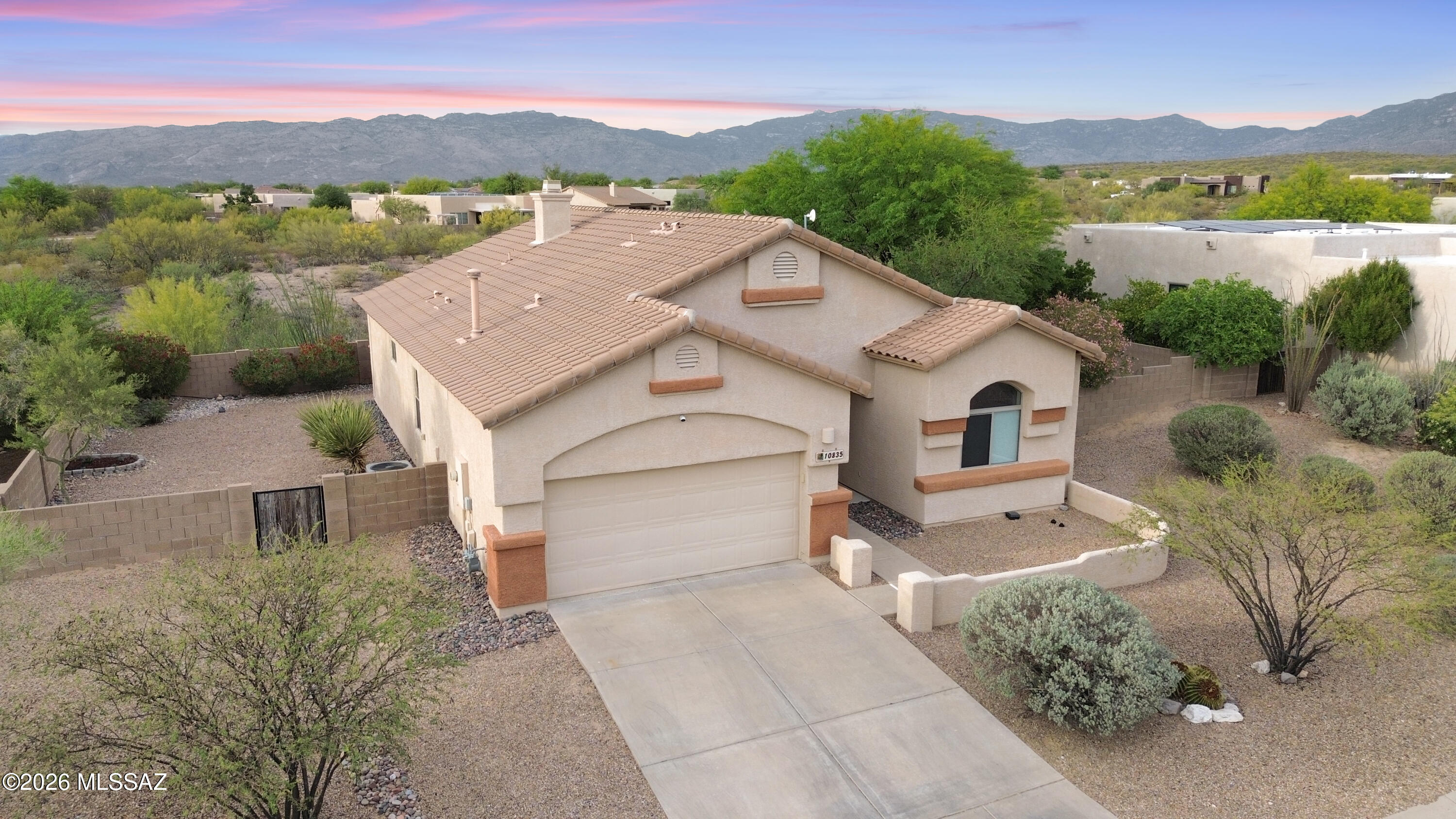 10835 South Heart Break Ridge Place Vail, AZ 85641 - Photo 48 of 49 a view of a house with a yard and a large tree