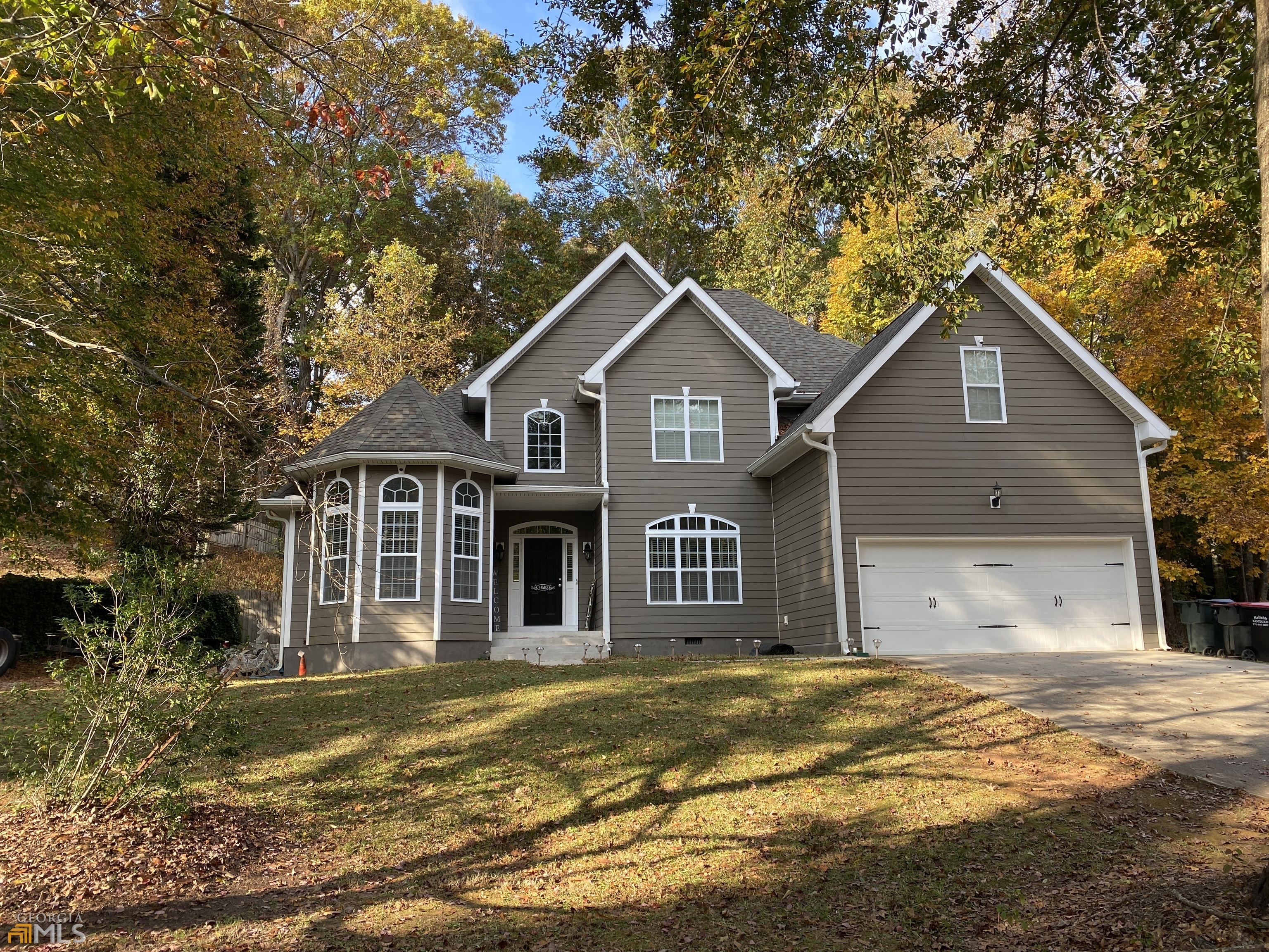 4010 Willow Ridge Road Douglasville, GA 30135 - Photo 1 of 1 a front view of a house with a garden