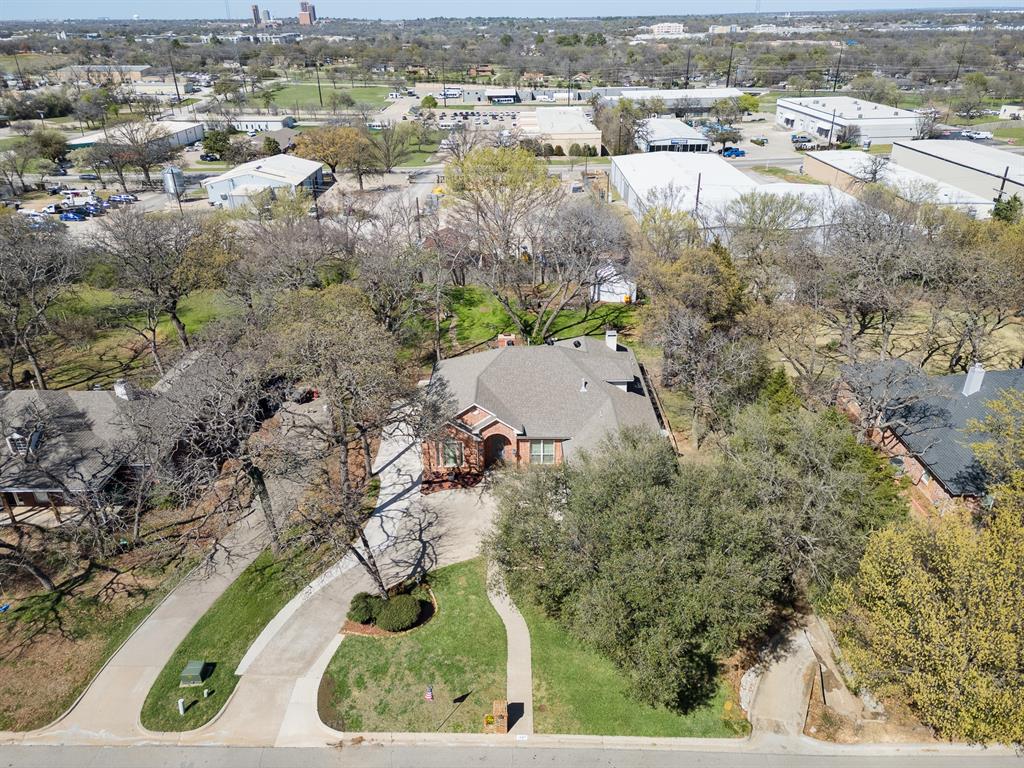 1007 Santa Fe Street Denton, TX 76205 - Photo 33 of 37 an aerial view of residential houses with outdoor space and trees