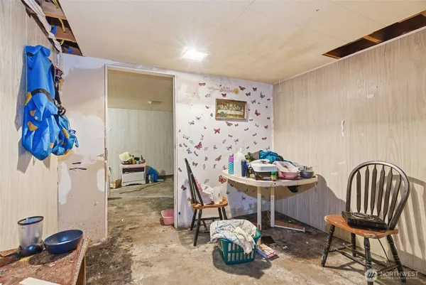 a living room with furniture and a chair