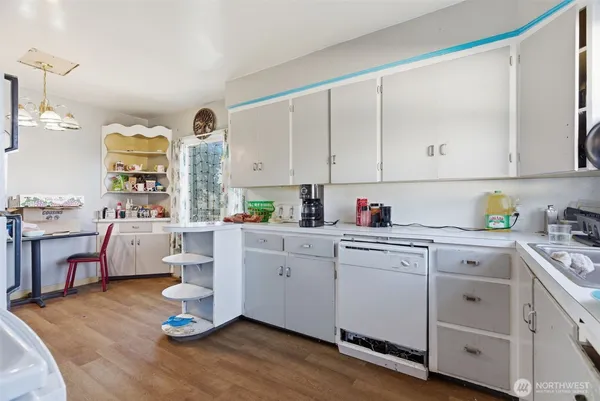 a kitchen with sink and cabinets