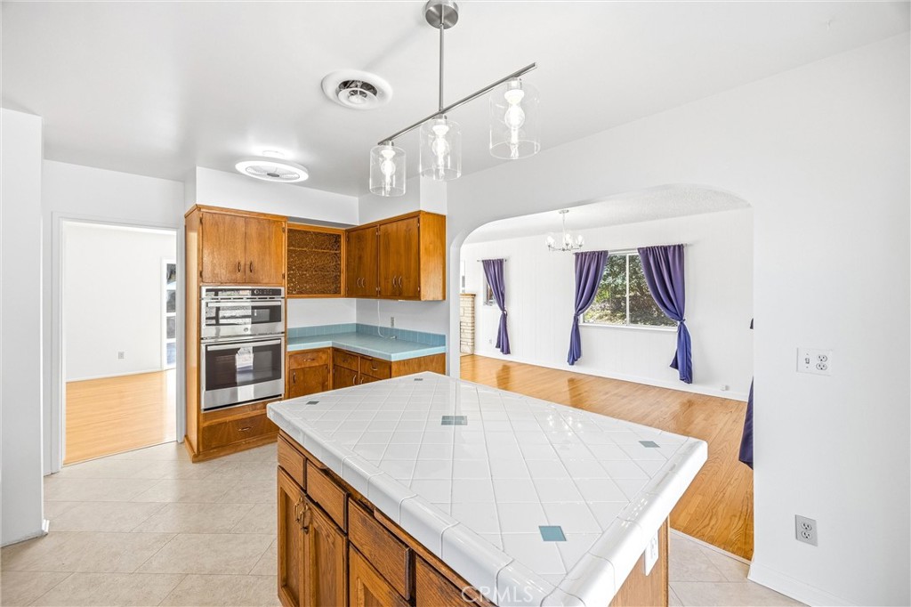 8705 Apple Tree Lane Cherry Valley, CA 92223 - Photo 17 of 72 Kitchen island for extra prep and storage space