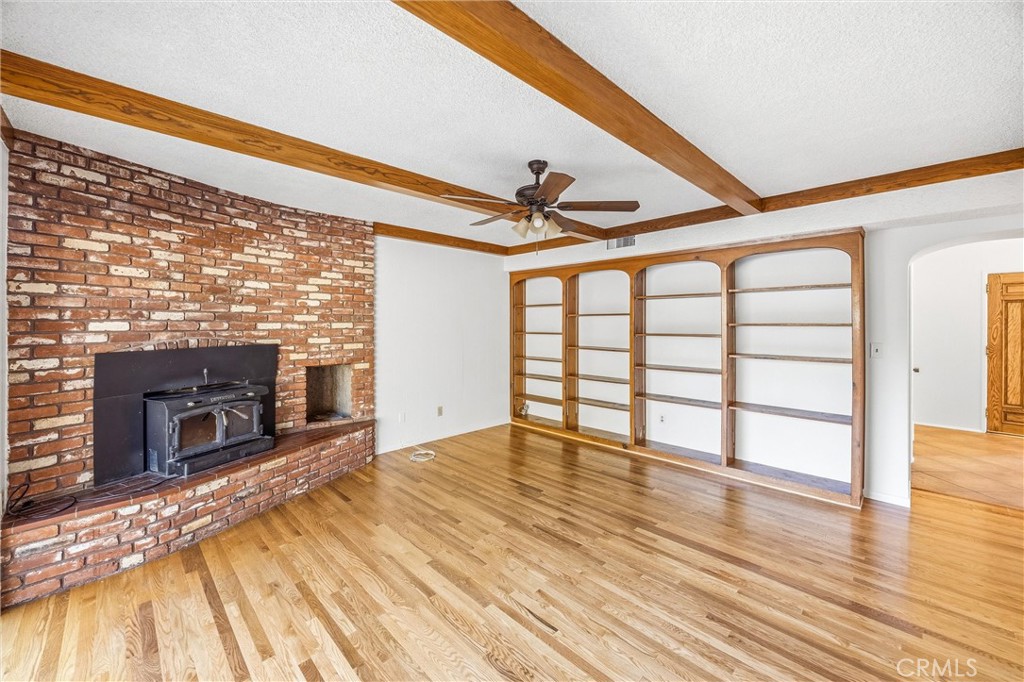 8705 Apple Tree Lane Cherry Valley, CA 92223 - Photo 24 of 72 Built in bookshelves and FP in family room
