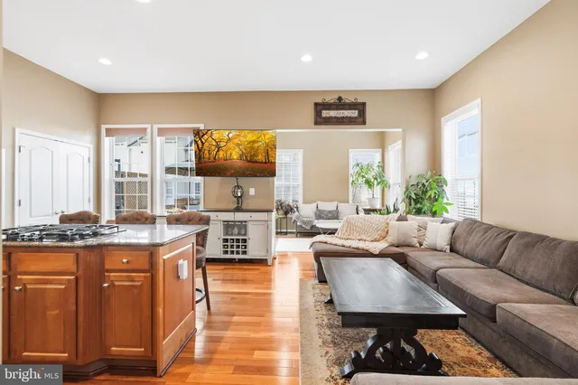 a living room with fireplace furniture and a flat screen tv