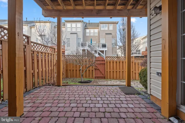 a view of a brick house with a large window