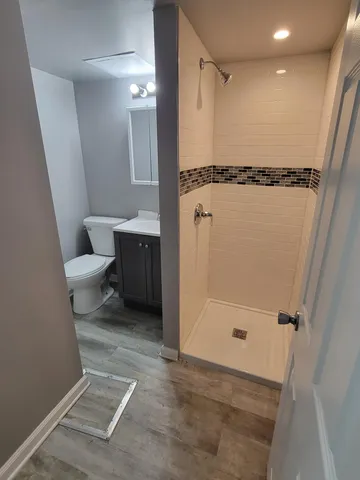 a bathroom with a tub and a shower