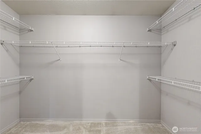a bathroom with a double vanity sink mirror and shower