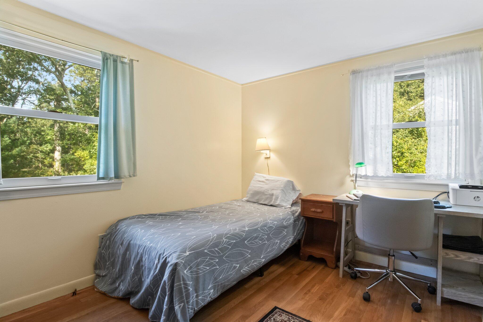 80 Prell Circle Brewster, MA 02631 - Photo 22 of 34 a bedroom with a bed and a table