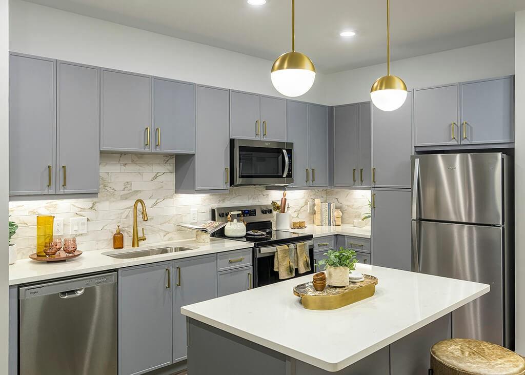 7260 Roswell Road, Unit B2 Sandy Springs, GA 30328 - Photo 13 of 23 a kitchen with a refrigerator a stove a sink a center island and cabinets