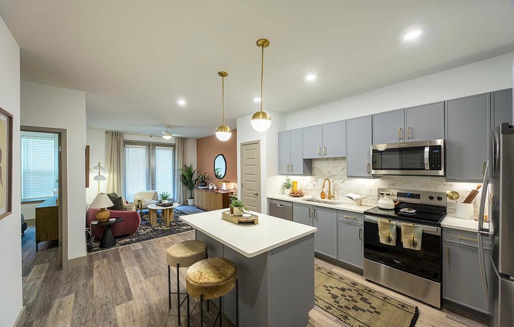 7260 Roswell Road, Unit B2 Sandy Springs, GA 30328 - Photo 17 of 23 a kitchen that has a lot of cabinets a sink and appliances in it