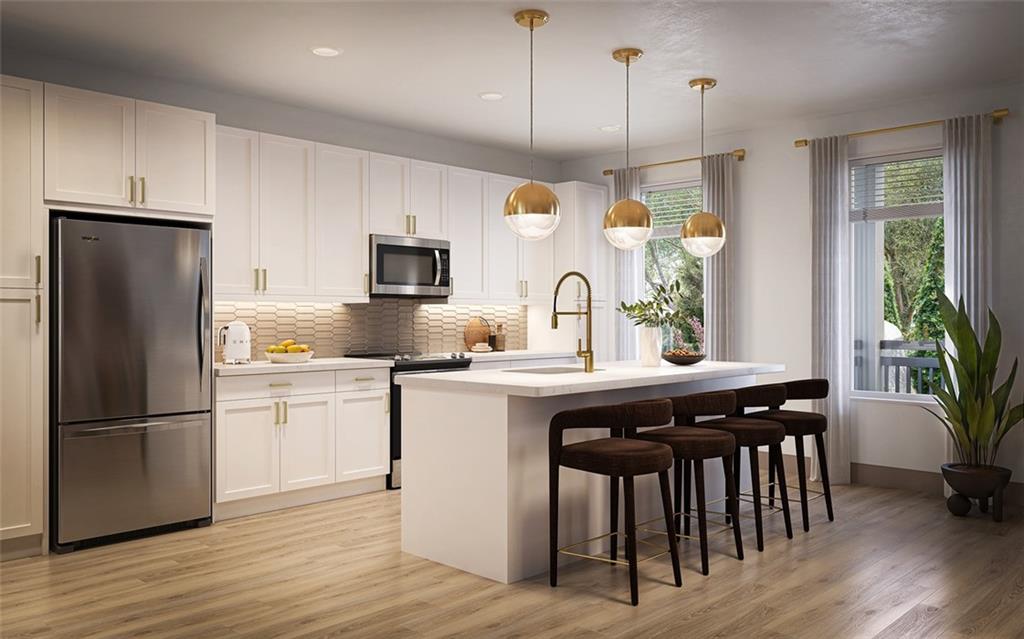 7260 Roswell Road, Unit B2 Sandy Springs, GA 30328 - Photo 5 of 23 a kitchen with stainless steel appliances granite countertop a refrigerator a sink dishwasher a stove and white cabinets with wooden floor