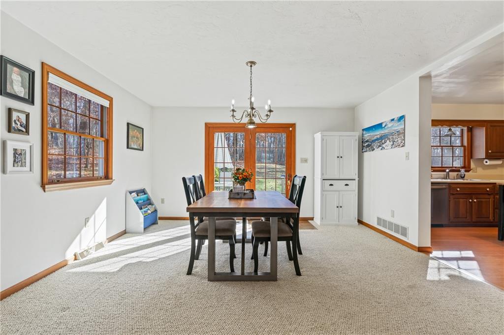 158 Becker Road Butler, PA 16002 - Photo 11 of 32 a view of a dining room with furniture window and wooden floor