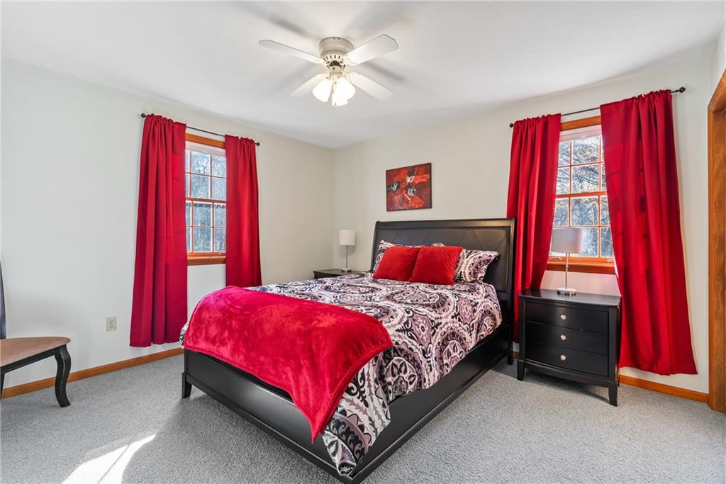 158 Becker Road Butler, PA 16002 - Photo 18 of 32 a bedroom with a bed and a chandelier