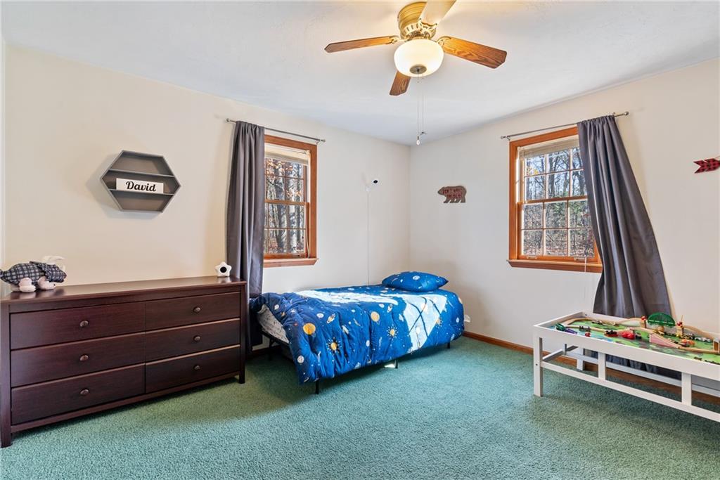 158 Becker Road Butler, PA 16002 - Photo 22 of 32 a bedroom with a bed and a chandelier