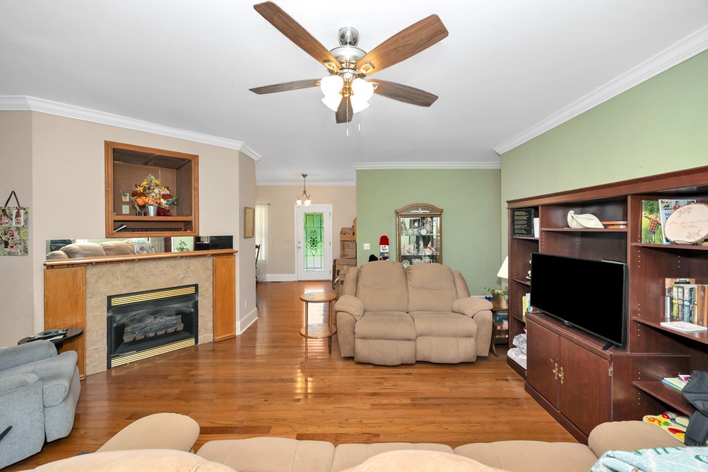 84 Scott Orchard Road Taft, TN 38488 - Photo 8 of 23 a living room with furniture flat screen tv and a fireplace